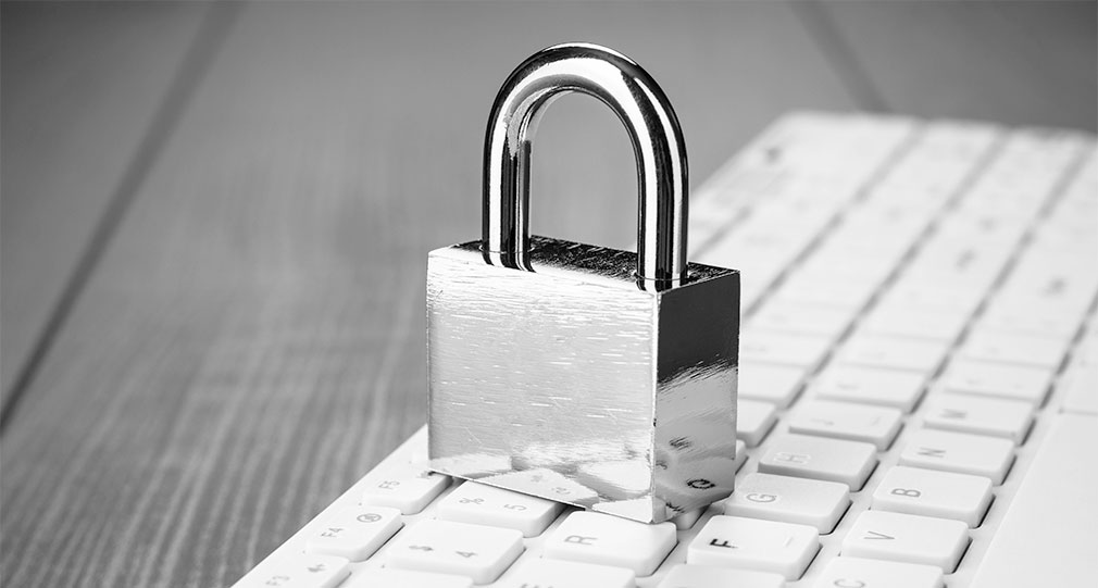 Lock sitting on top of computer keyboard